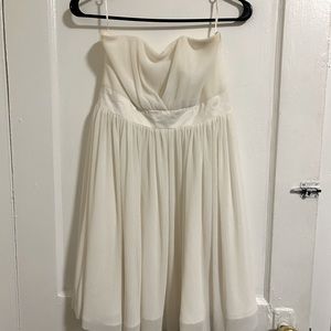 White knee-length strapless graduation dress